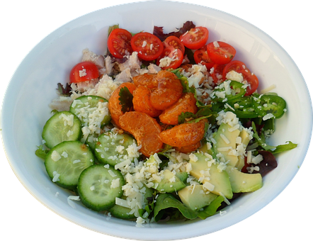 A Bowl Of Salad With Vegetables And Cheese