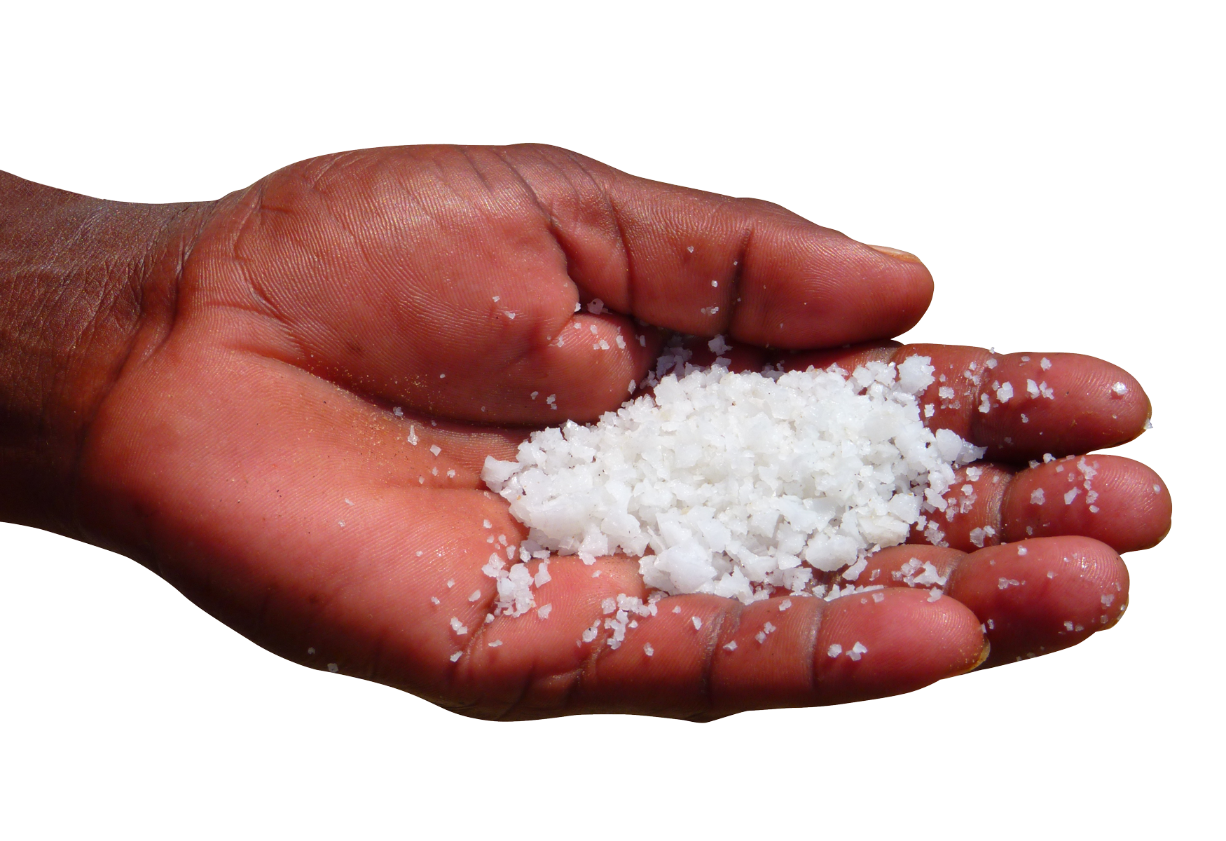 A Hand Holding A Handful Of Salt