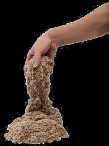 A Hand Holding A Pile Of Sand