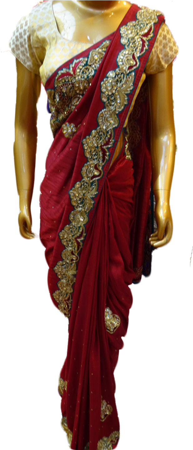 A Mannequin Wearing A Red And Gold Dress