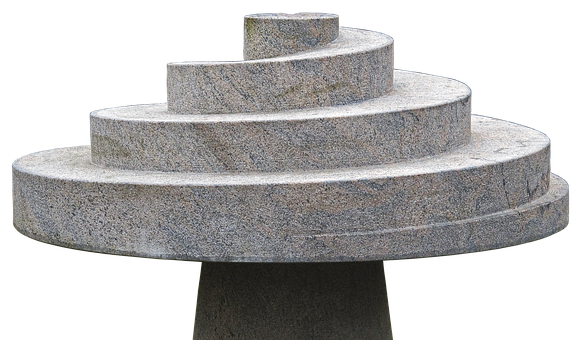 A Stone Sculpture Of A Spiral