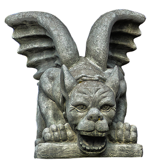 A Stone Statue Of A Gargoyle With Wings
