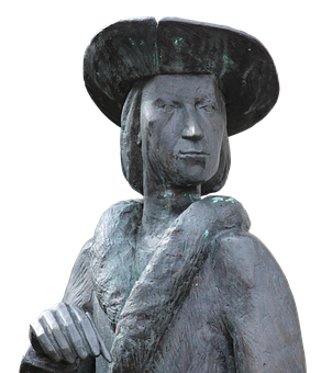 A Statue Of A Man Wearing A Hat