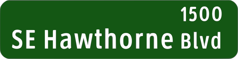 A Green Sign With White Text