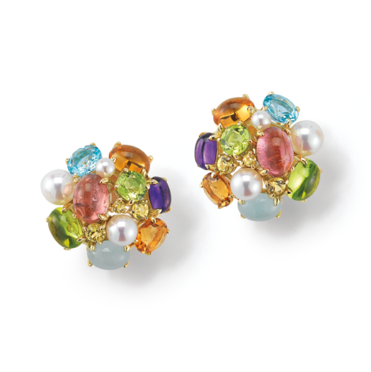 A Pair Of Earrings With Colorful Stones
