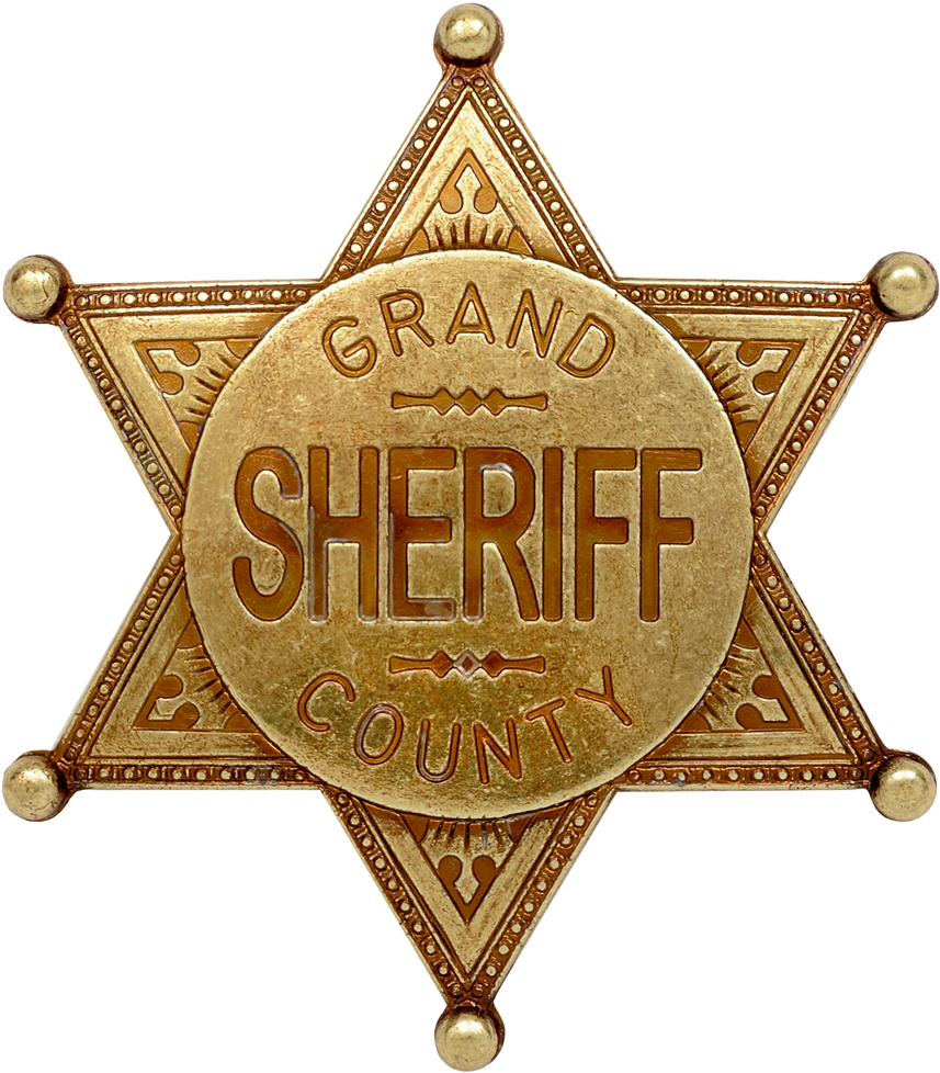 A Gold Star Shaped Badge With Text