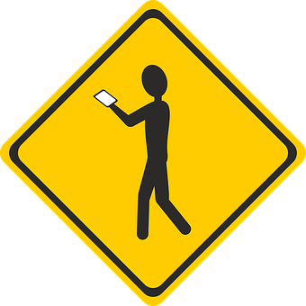 A Yellow Sign With A Person Holding A Paper