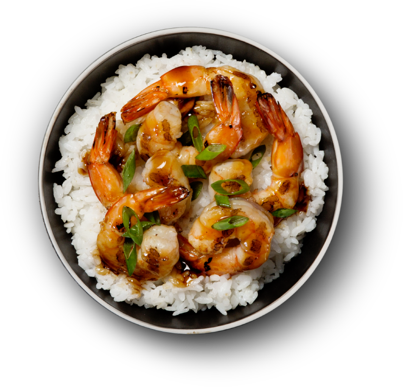 A Bowl Of Rice With Shrimp And Sauce