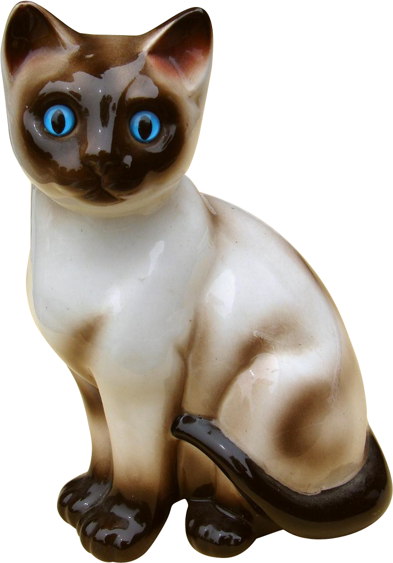 A Ceramic Cat With Blue Eyes