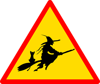 A Sign With A Person Riding A Broomstick