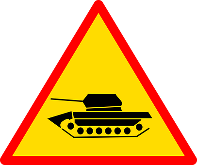 A Yellow Triangle With A Black Tank On It