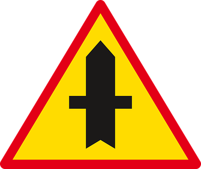 A Yellow Triangle With A Black Arrow On It