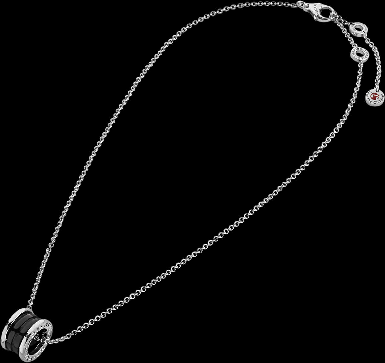 A Silver Necklace With A Black And White Pendant