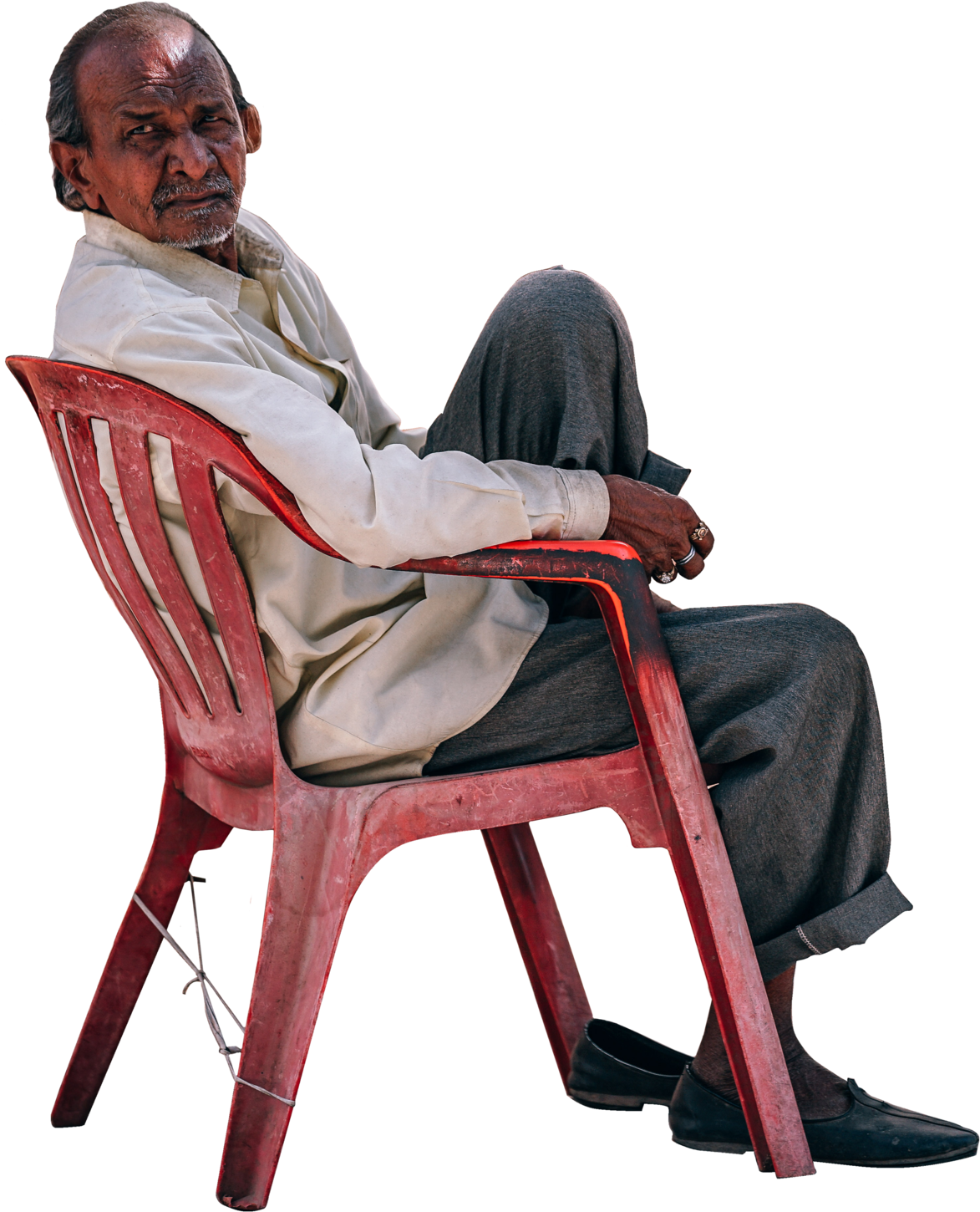 A Man Sitting In A Red Chair