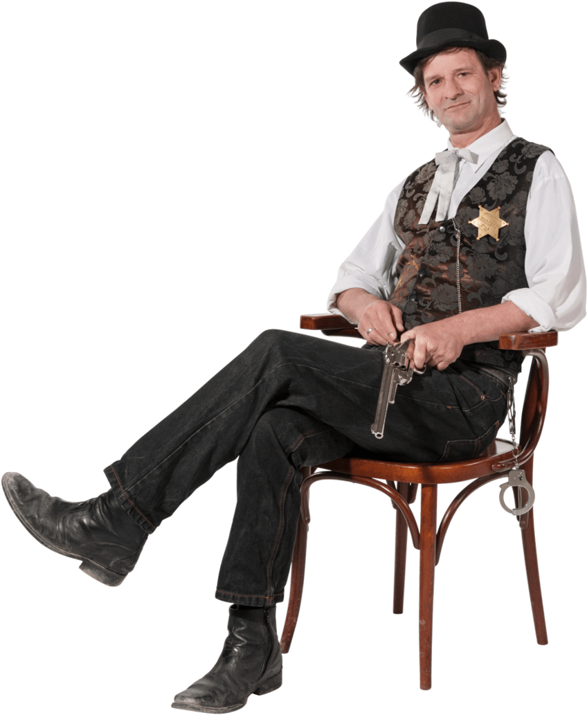 A Man In A Garment Sitting On A Chair