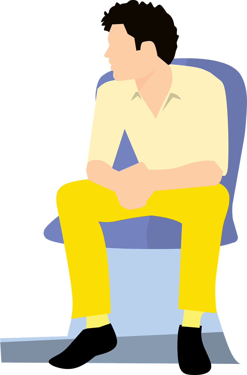 A Man Sitting In A Chair