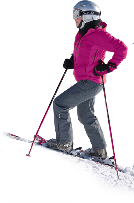A Woman In A Pink Jacket And Grey Pants Skiing