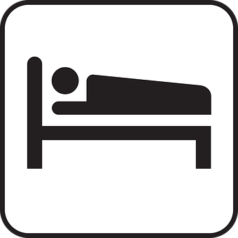 A Black And White Sign With A Person Lying On A Bed