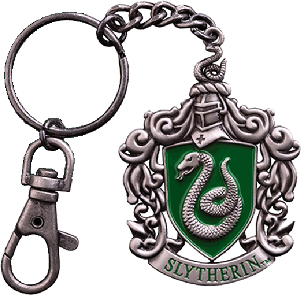 A Key Chain With A Green Shield And A Snake
