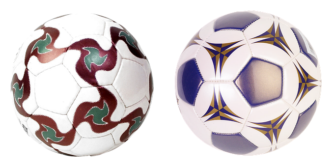 A Close-up Of Two Football Balls