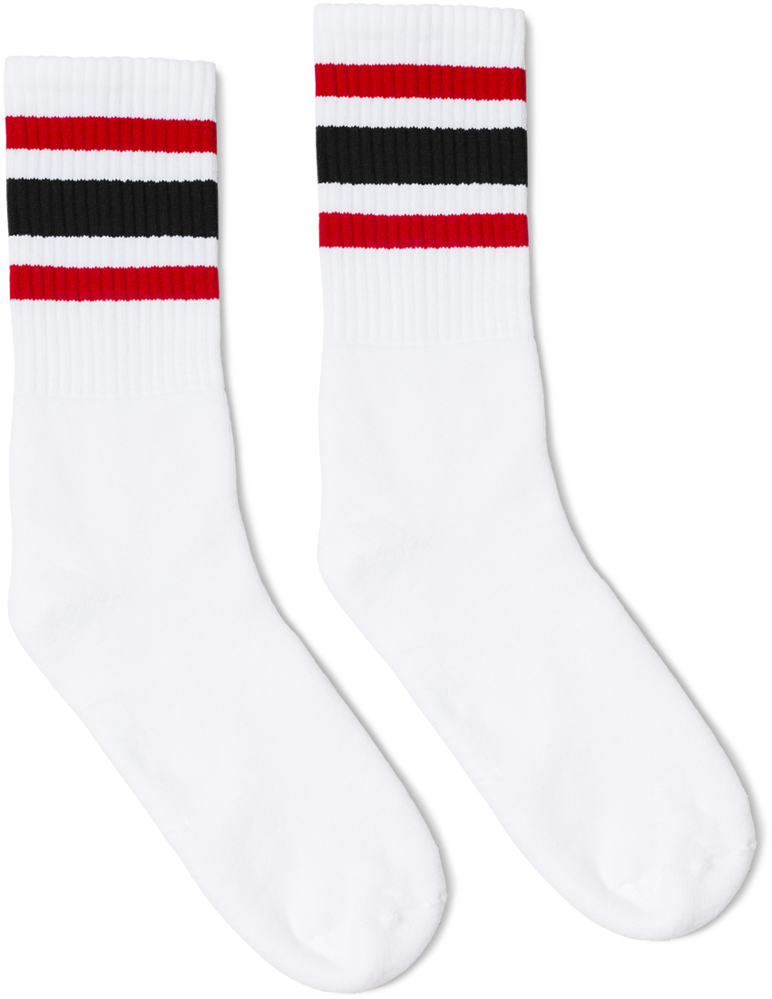 A Pair Of White Socks With Red And Black Stripes