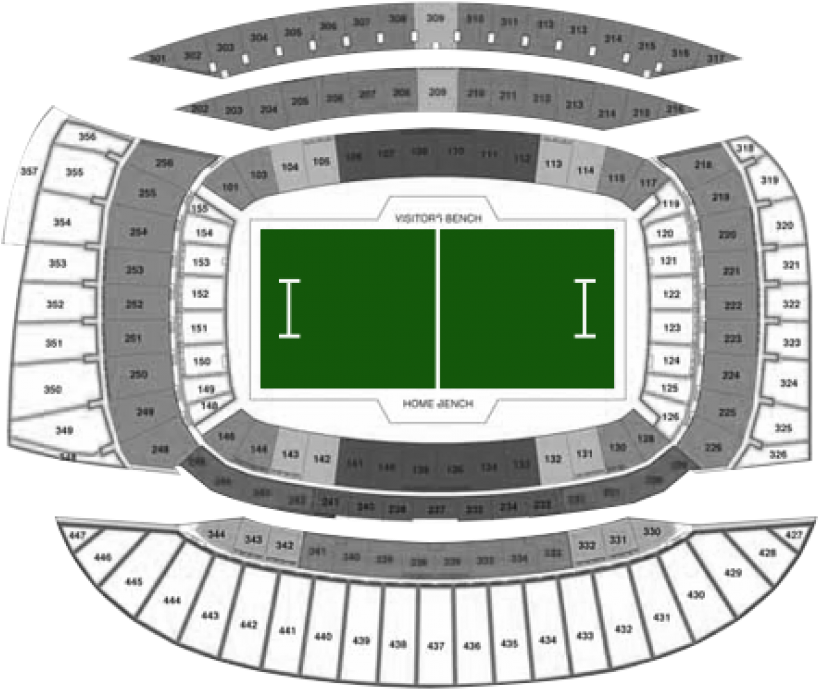 A Stadium With A Green Field And White Seats