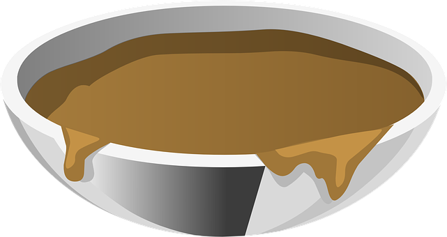 A Bowl Of Brown Liquid