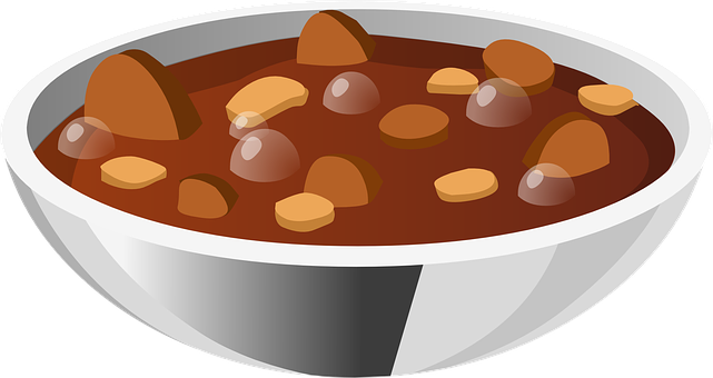 A Bowl Of Soup With Brown Liquid And Brown Food