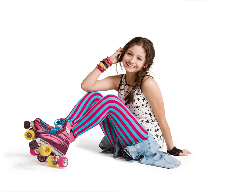 A Girl Sitting On The Floor With Roller Skates