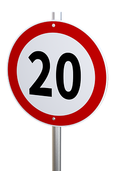 A Red And White Sign With Black Numbers