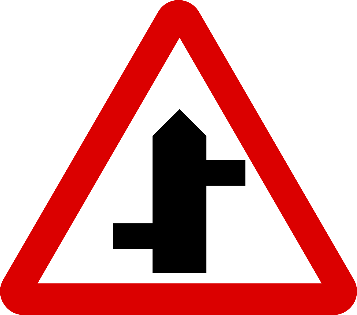 A Red And White Triangle Sign With A Black And White Sign