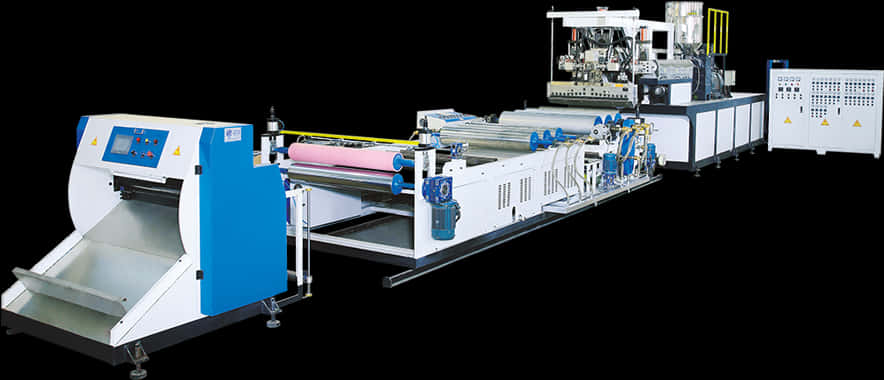 A Large Machine With Rolls Of Paper