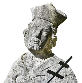 A Statue Of A Man With A Cross