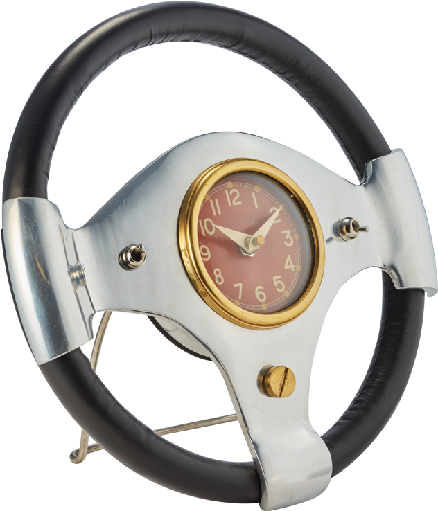 A Steering Wheel With A Red Clock