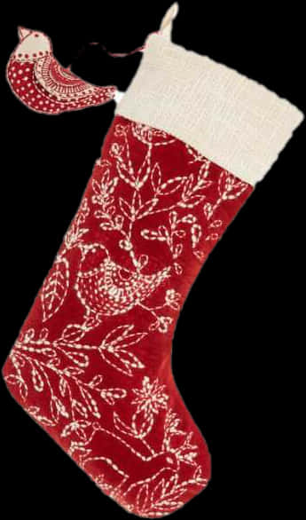 A Red And White Stocking With A Bird Design