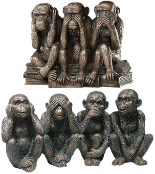 Statues Of Monkeys Sitting On Books