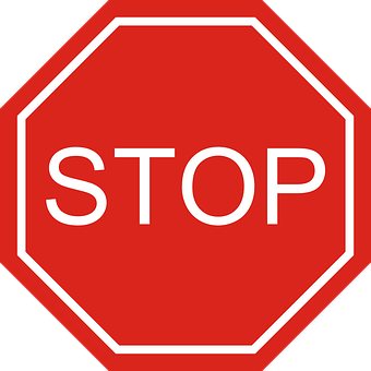 A Red And Black Stop Sign