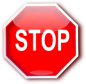 A Red Stop Sign With White Text