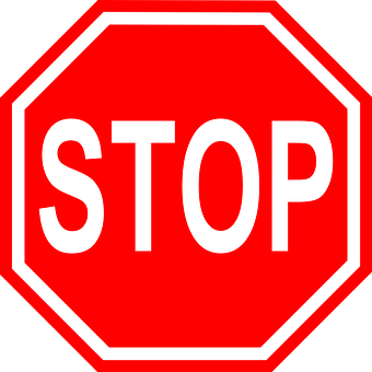 A Red And Black Stop Sign
