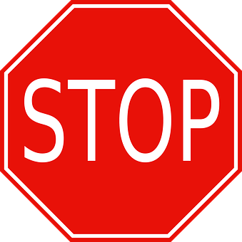 A Red Stop Sign With White Text