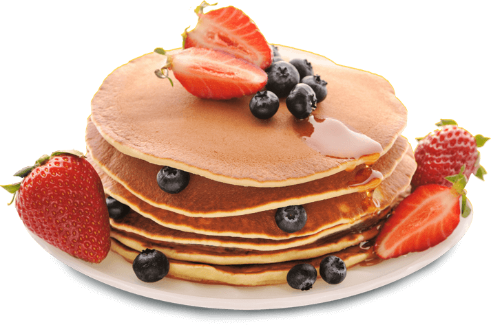 A Stack Of Pancakes With Strawberries And Syrup On Top