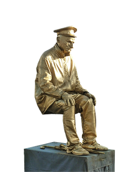 A Statue Of A Man In Gold