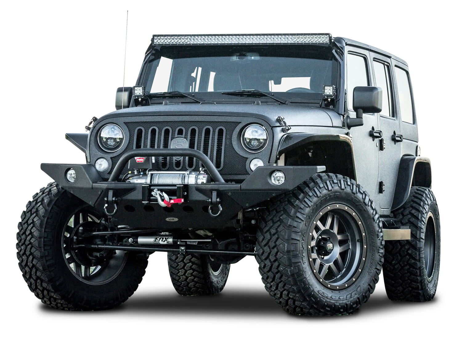 A Black Jeep With Large Tires