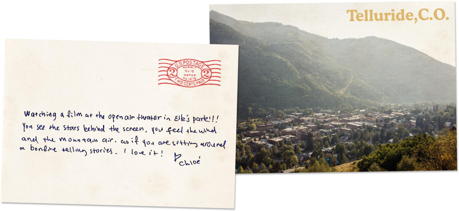 A Postcard With A City In The Background