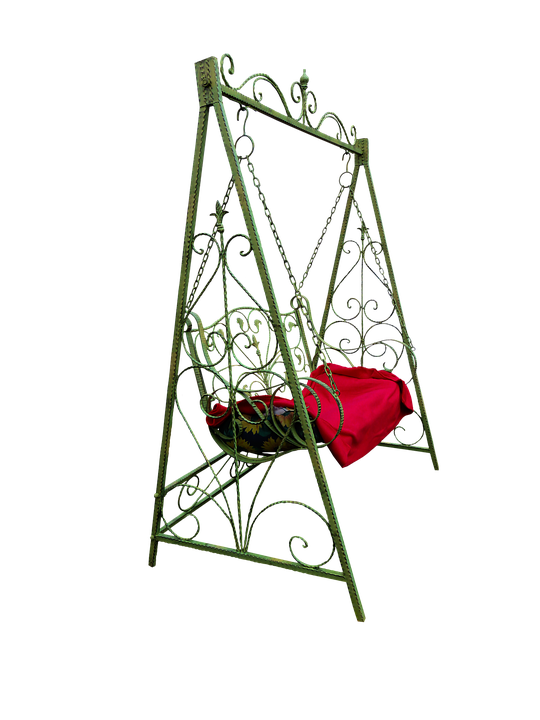 A Green Metal Swing With A Red Blanket