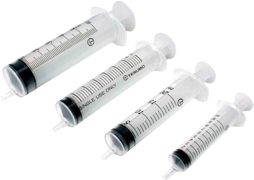 A Group Of Syringes With Caps