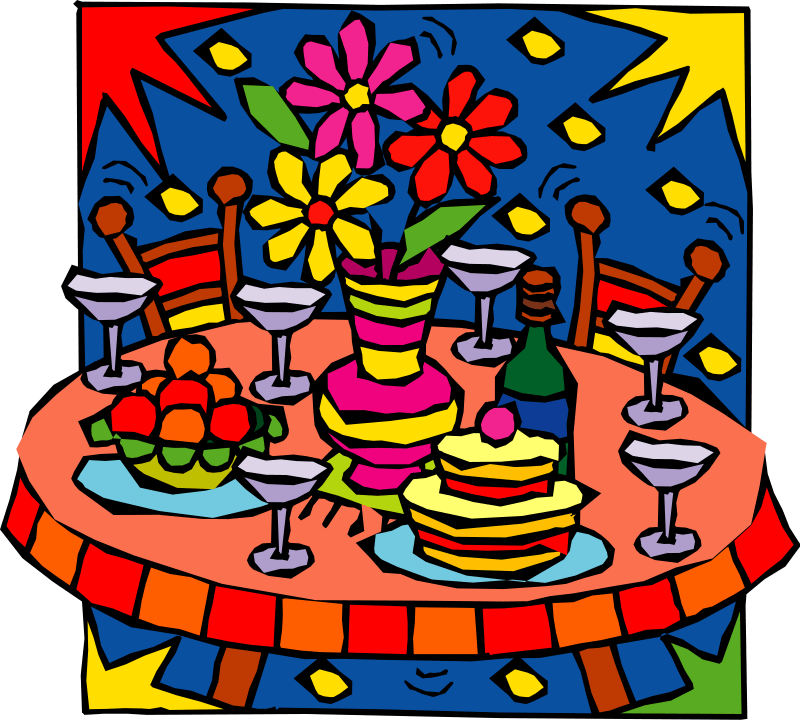 A Table With Food And Flowers