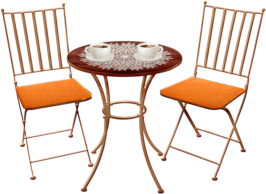 Two Cups Of Coffee On A Table With Two Chairs