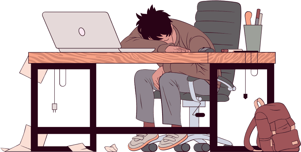 A Man Sleeping At A Desk