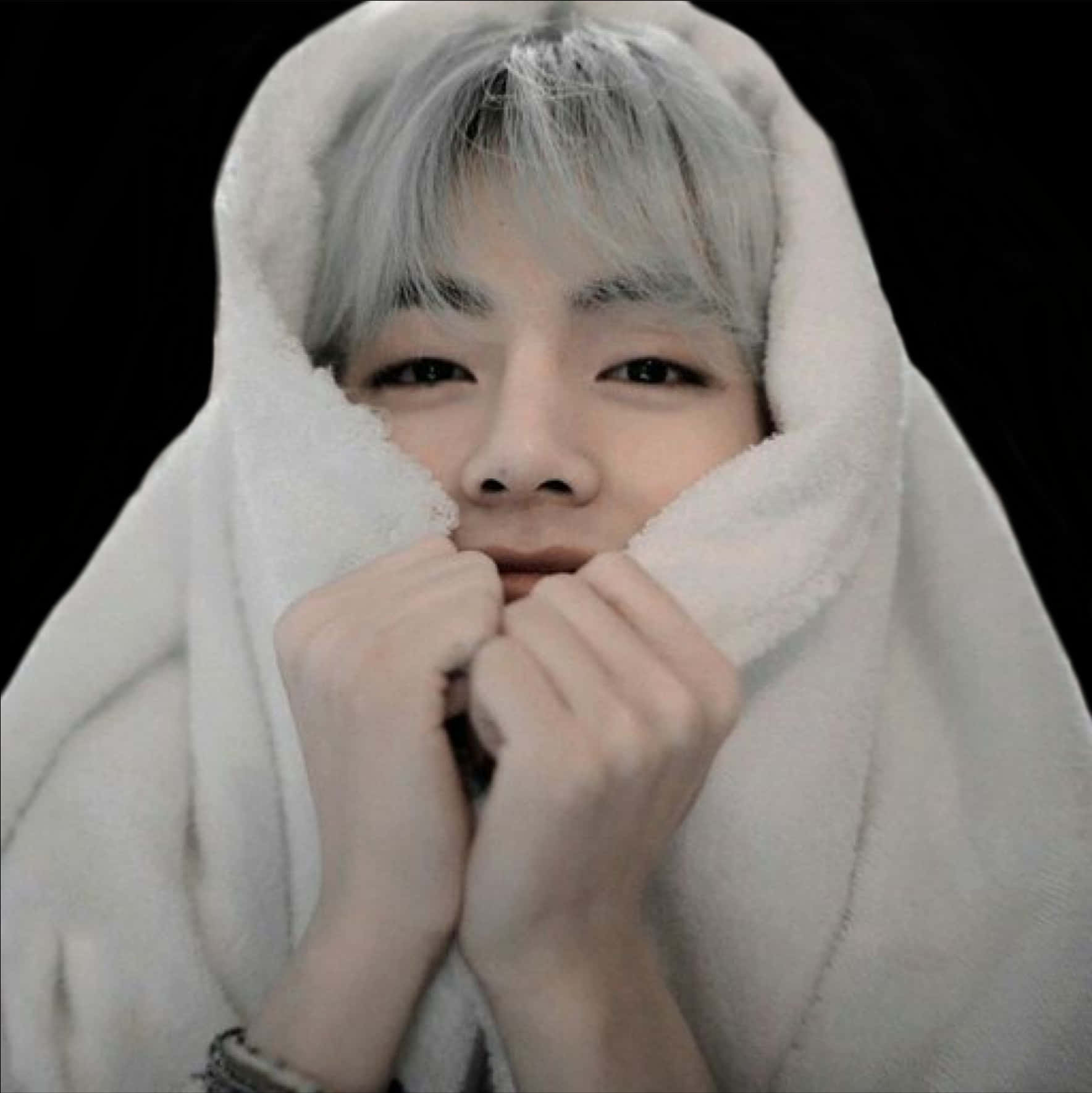 A Person With White Hair And A White Blanket Covering Their Face